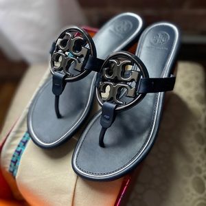 Navy blue Tory Burch sandals.